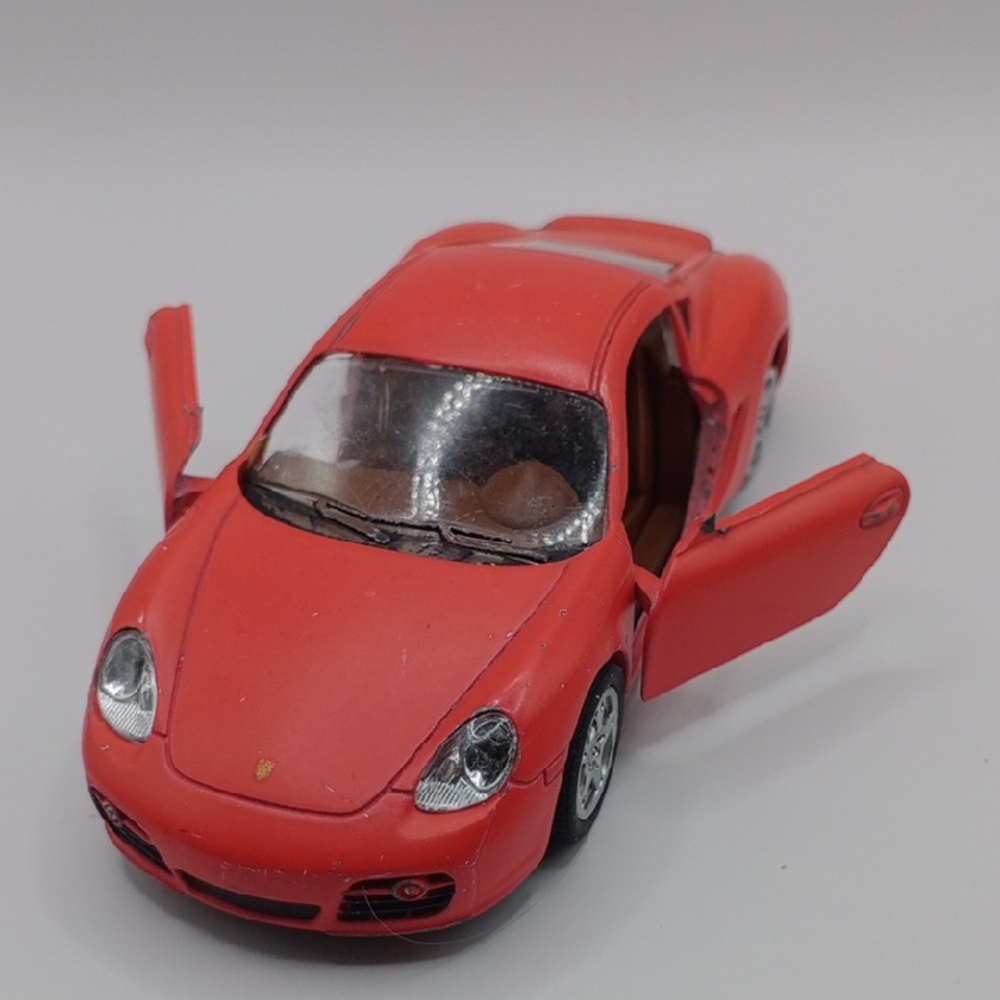 Red Die-Cast Toy Car with Opening Doors